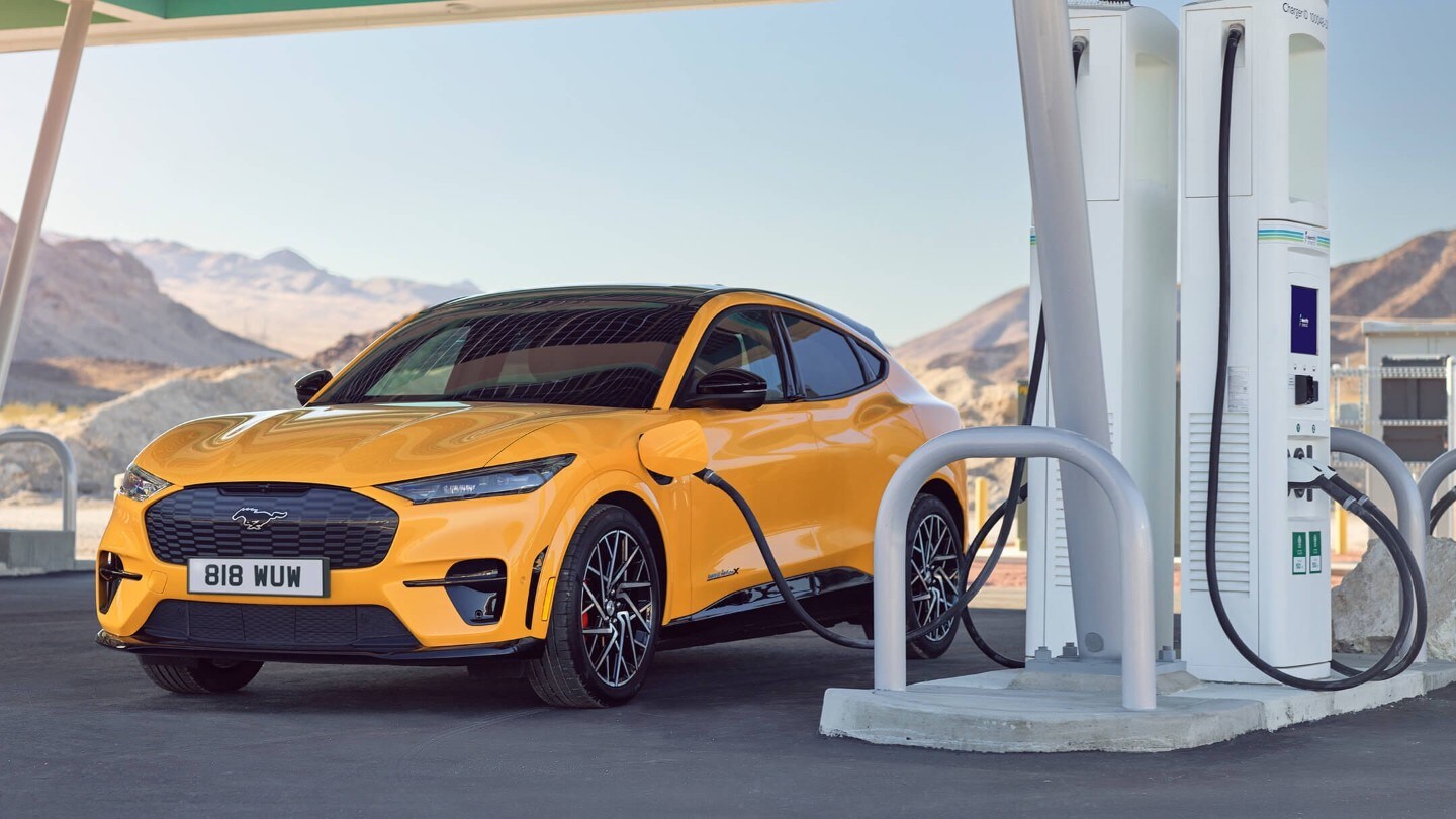 Yellow Ford Mustang Mach-E Charging at a charging station