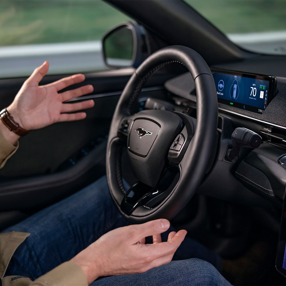 A person driving with BlueCruise