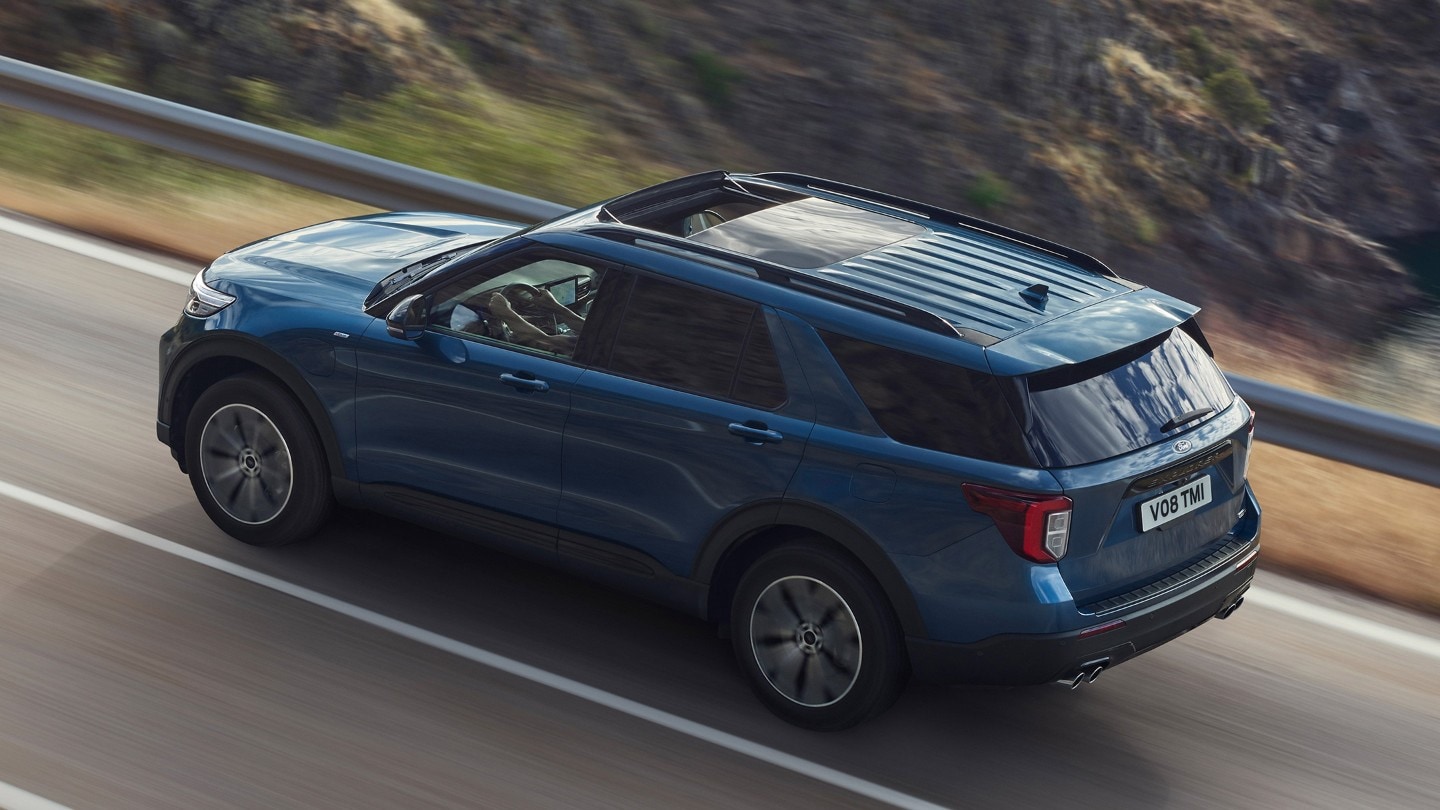 Ford Explorer driving on mountain road bird's eye view