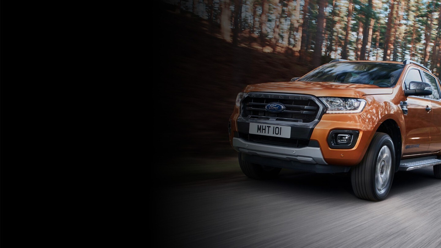 Ford Ranger driving on rural road
