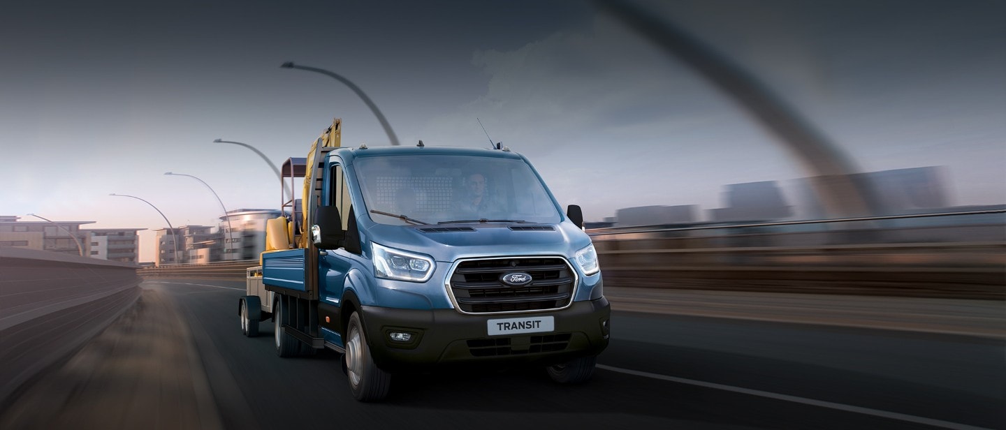 New Ford Transit Chassis Cab front view driving on road New Ford Transit Chassis Cab front view driving on road