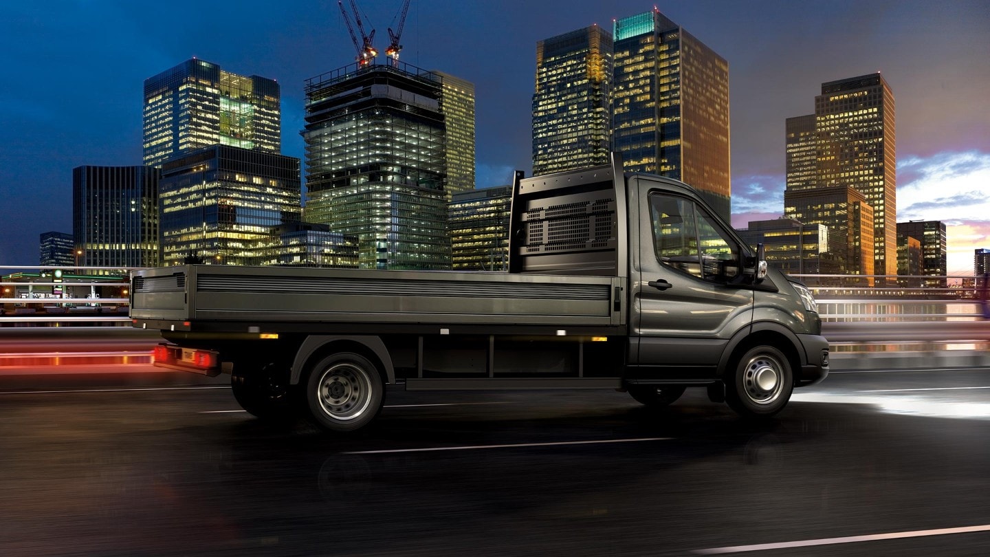 Ford Transit Chassis Cab side view driving at night