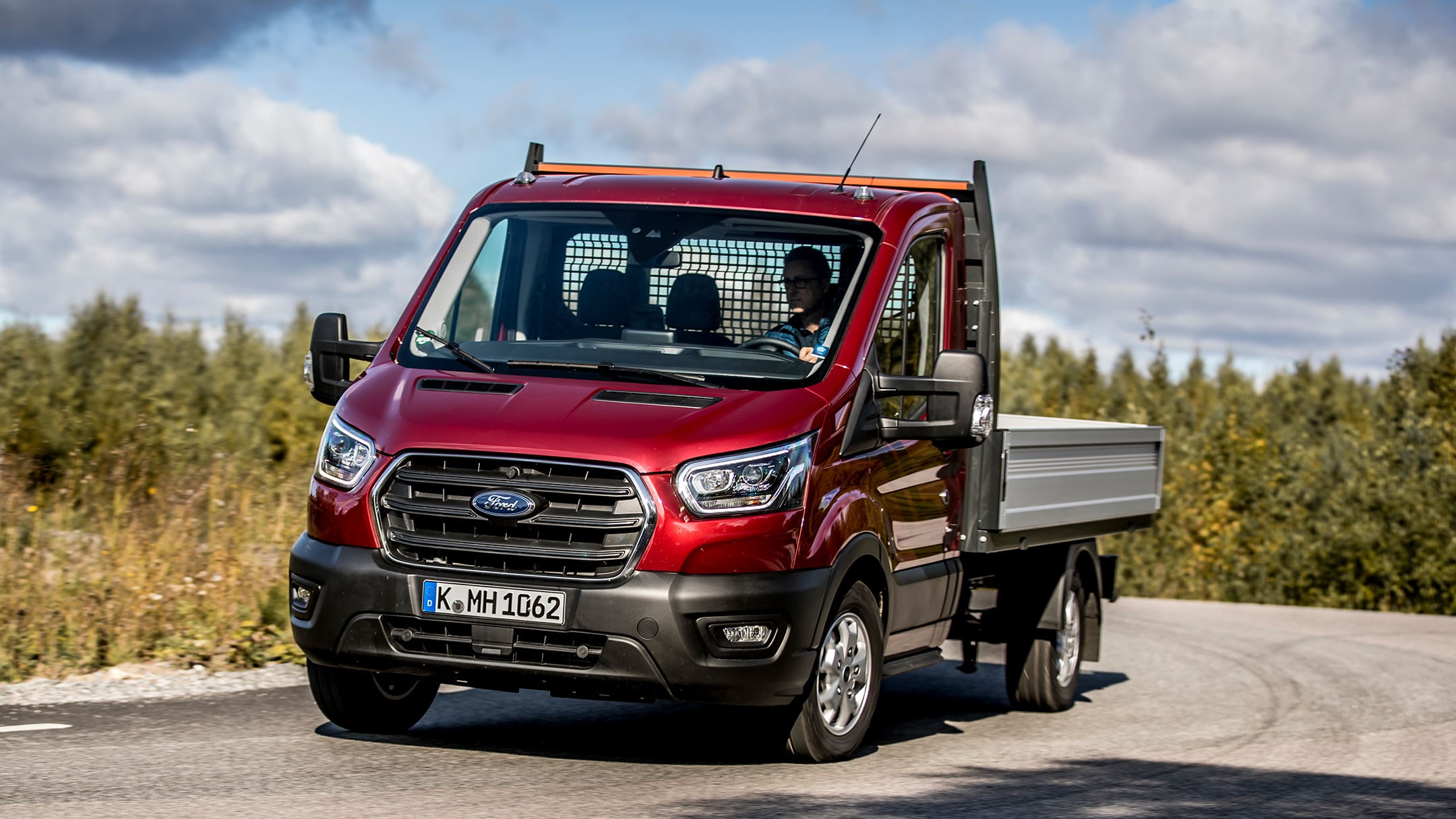 Ford Transit Chassis Cab driving on bendy road in forest