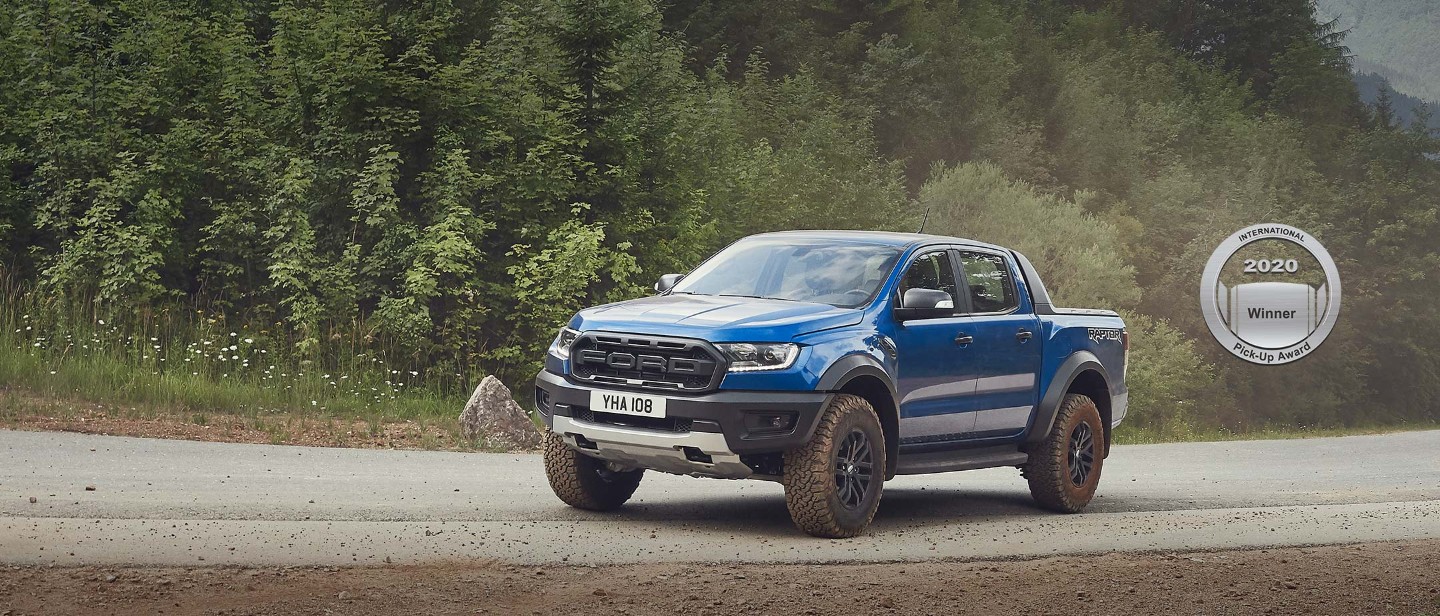 Blue Ford Ranger Raptor parked, profile view