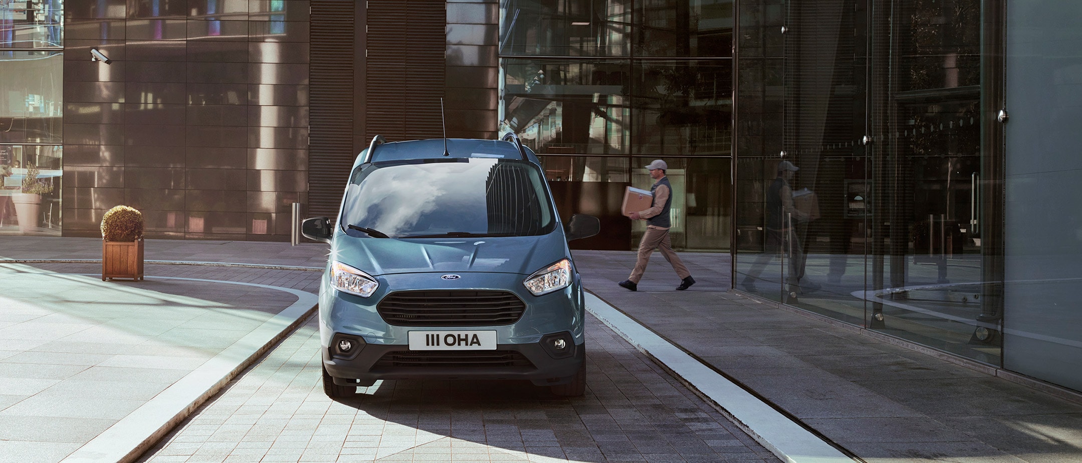 Ford Transit Courier parked outside office building