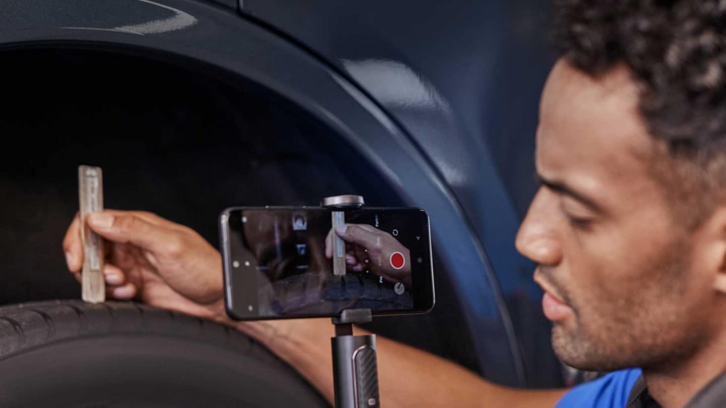 Ford mechanic doing a video check